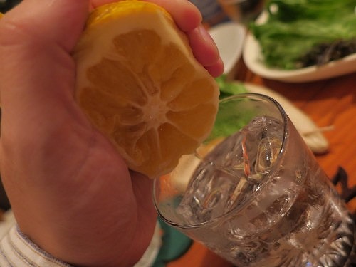 Shima Shochu with a citrus fruit